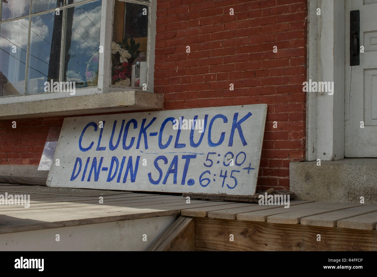 sign in front of old red brick building in downtown rural Waitsfield, VT. Stock Photo