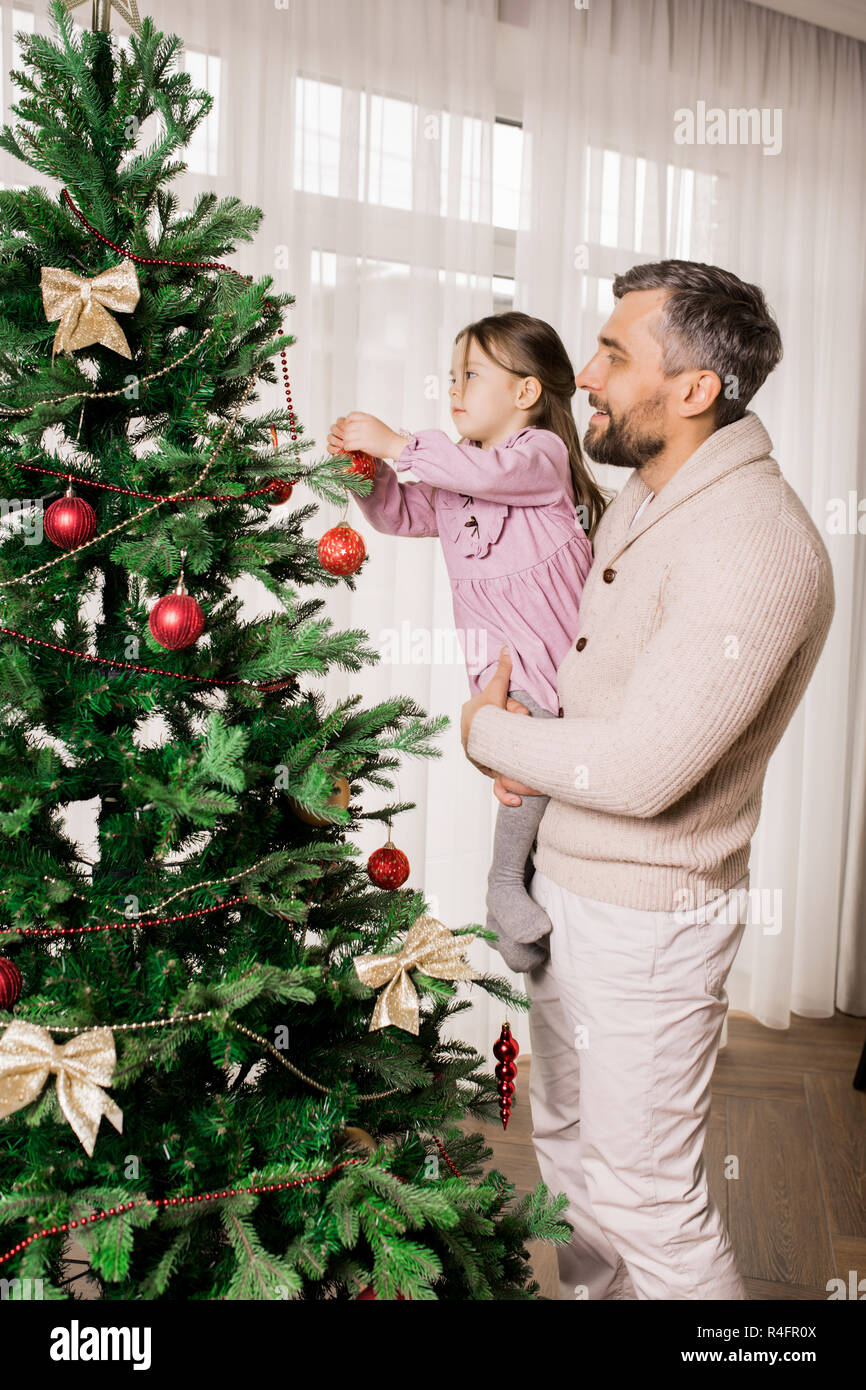 Father and Child Preparing for Christmas Stock Photo