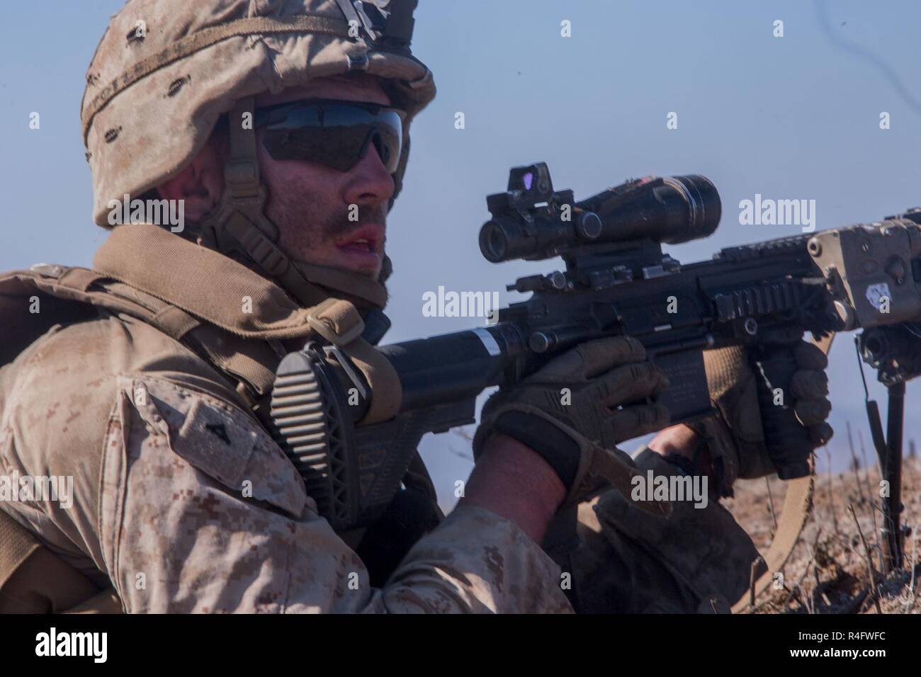 Lance Cpl. Seth Trunick, a scout rifleman with 1st Light Armored Reconnaissance Battalion, 1st Marine Division, calls out an ammunition, casualties and equipment report during a field exercise aboard Marine Corps Base Camp Pendleton, Calif., Oct. 25, 2016. The exercise was held as part of a week-long Marine Corps Combat Readiness Evaluation. Marines undergo MCCREs to ensure combat readiness before deployments. An ACE report is a brief report passed up through the team to let leaders know the status of the unit’s ammunition, casualties and equipment. Stock Photo