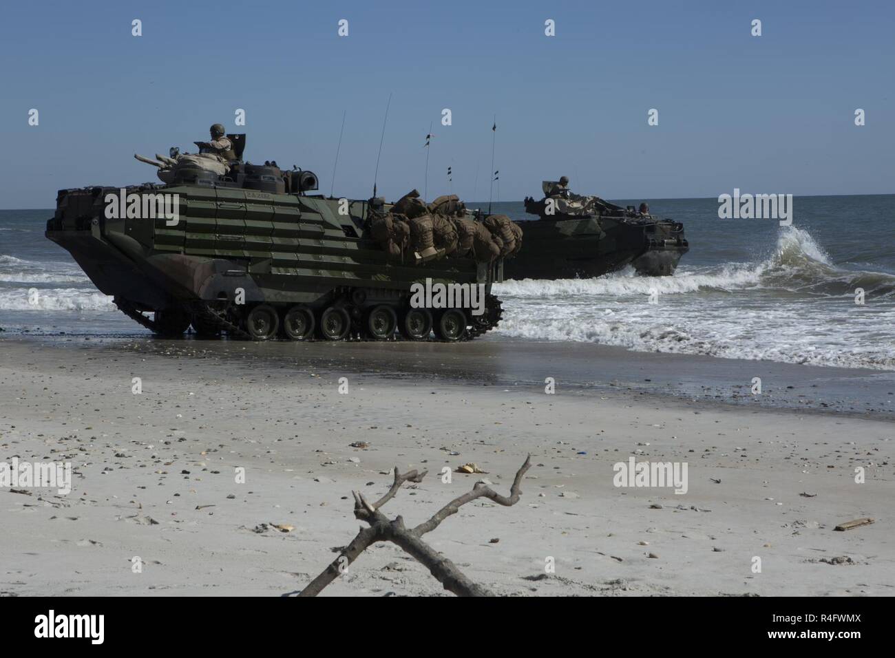 U.S. Marines with 2nd Assault Amphibian Battalion, 2nd Marine Division, (2d MARDIV), maneuver Assault Amphibious Vehicles (AAV-7A1) during an amphibious movement as part of Marine Corps Combat Readiness Evaluation, (MCCRE), Camp Lejeune, N.C., Oct. 24, 2016. MCCRE is a pre-deployment training evaluation designed to test the skills of Marines and Sailors with possible combat scenarios. Stock Photo