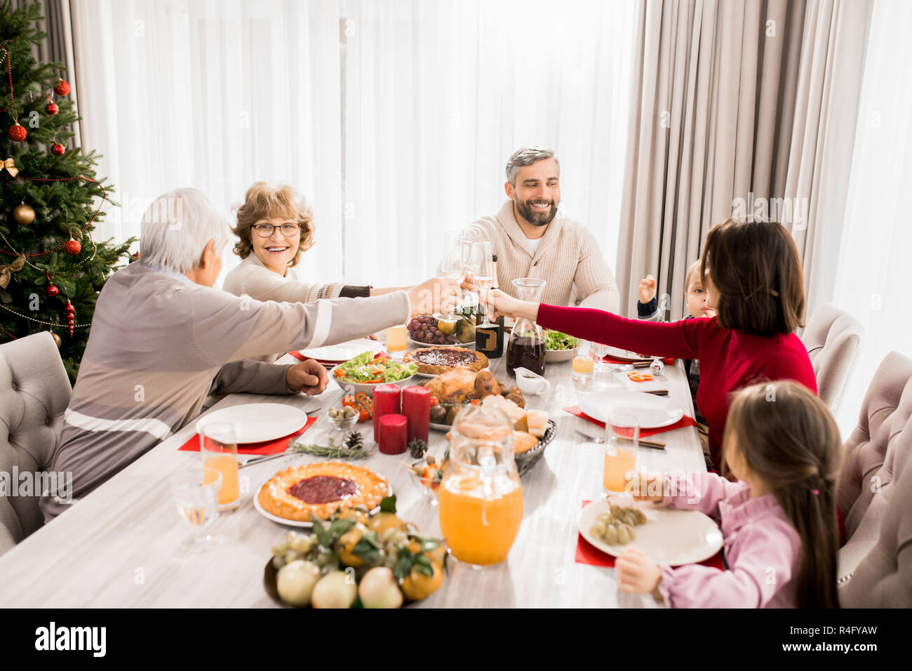 Family Enjoying Christmas Dinner Stock Photo Alamy