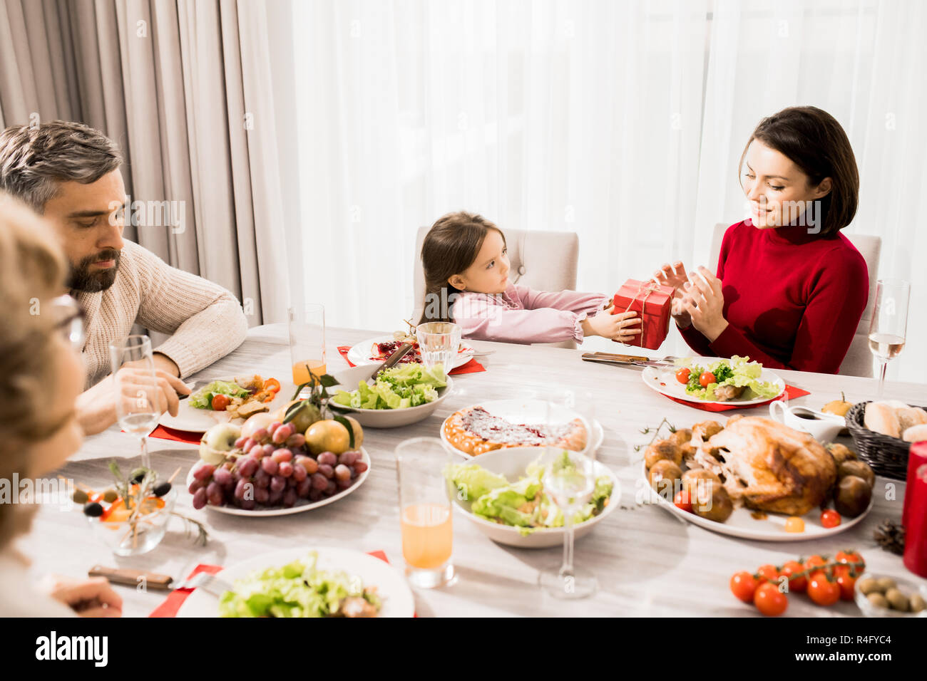 Cute Girl Giving Present to Mother Stock Photo