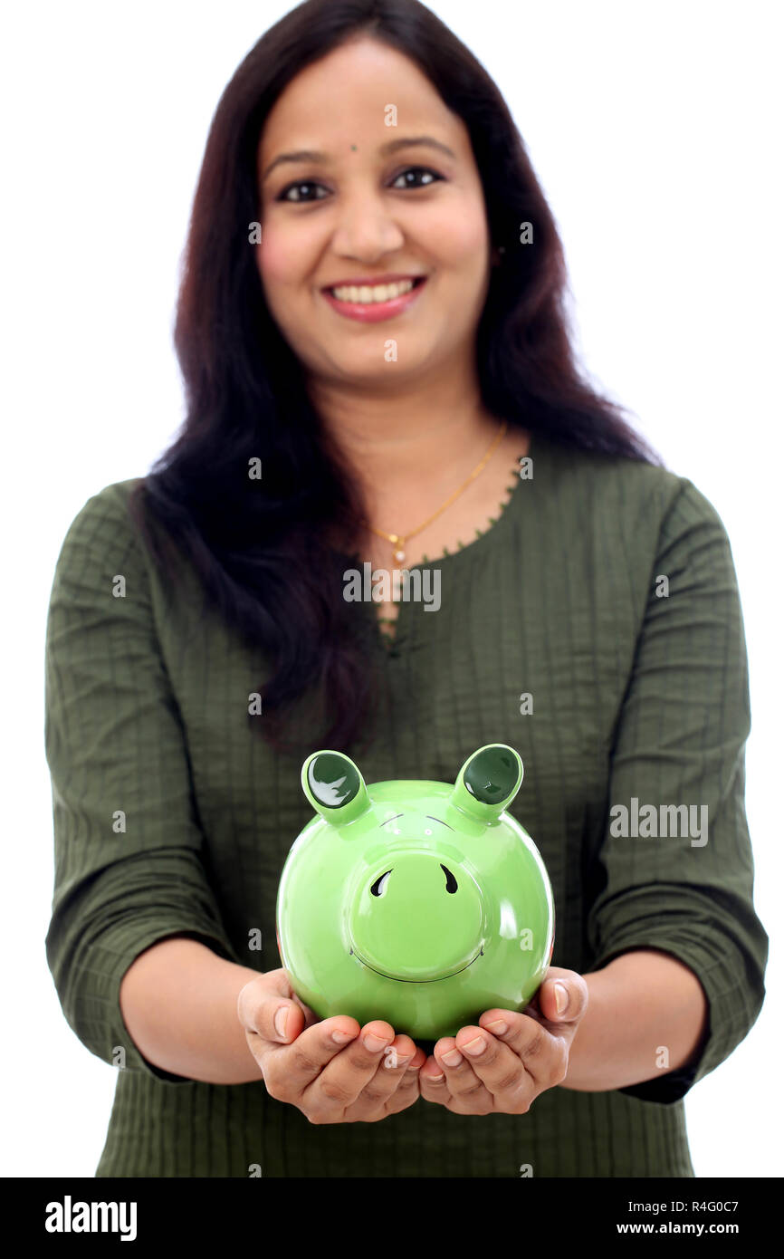 Young Indian Woman Saves Money in Piggy bank Stock Photo - Alamy