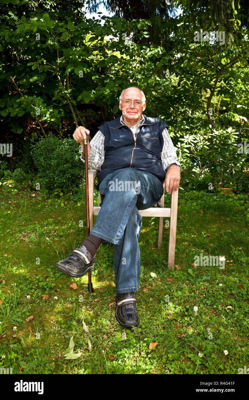 elderly man sitting in the garden Stock Photo - Alamy