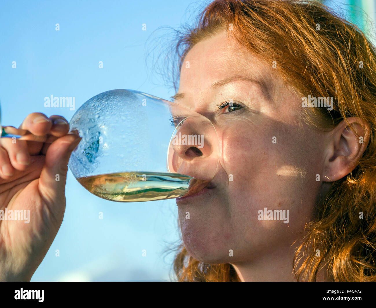 woman drinking white wine Stock Photo Alamy