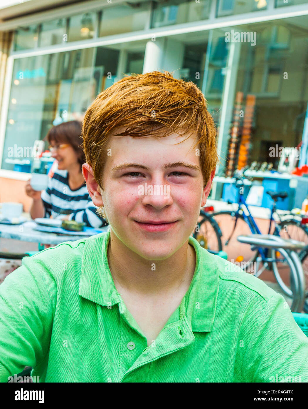 boy with red hair is looking happy and friendly Stock Photo