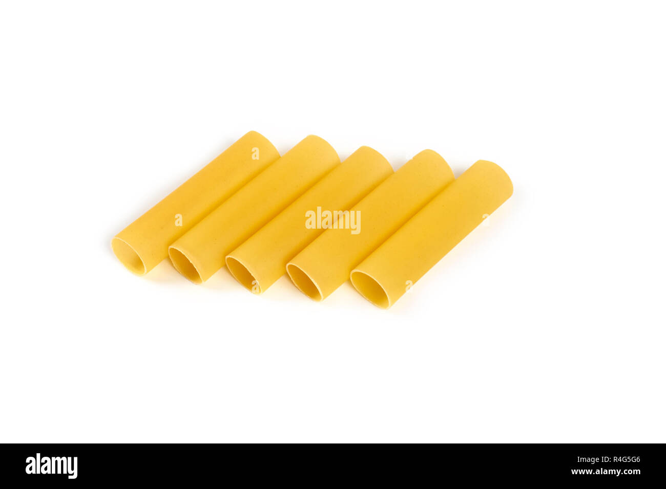 Italian cannelloni pasta tubes isolated over white background. Stock Photo