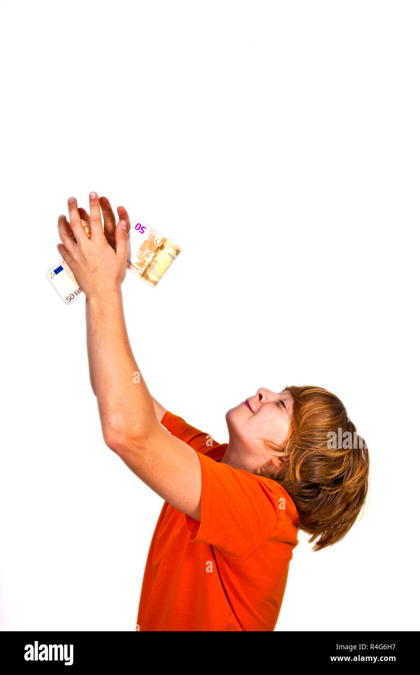 Euros flying around a boys head Stock Photo