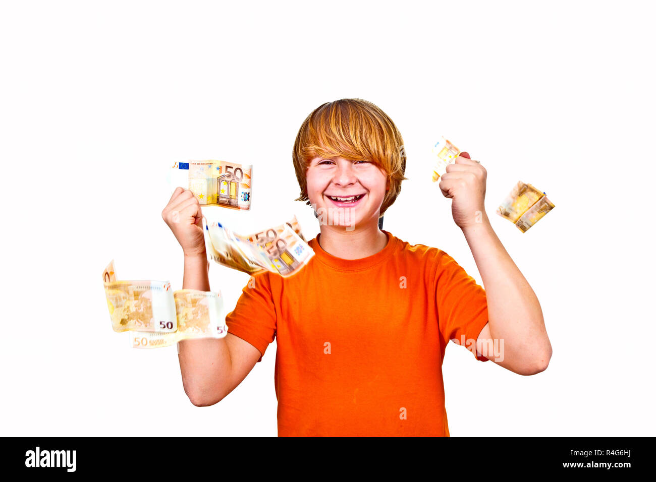 Euros flying around a boys head Stock Photo