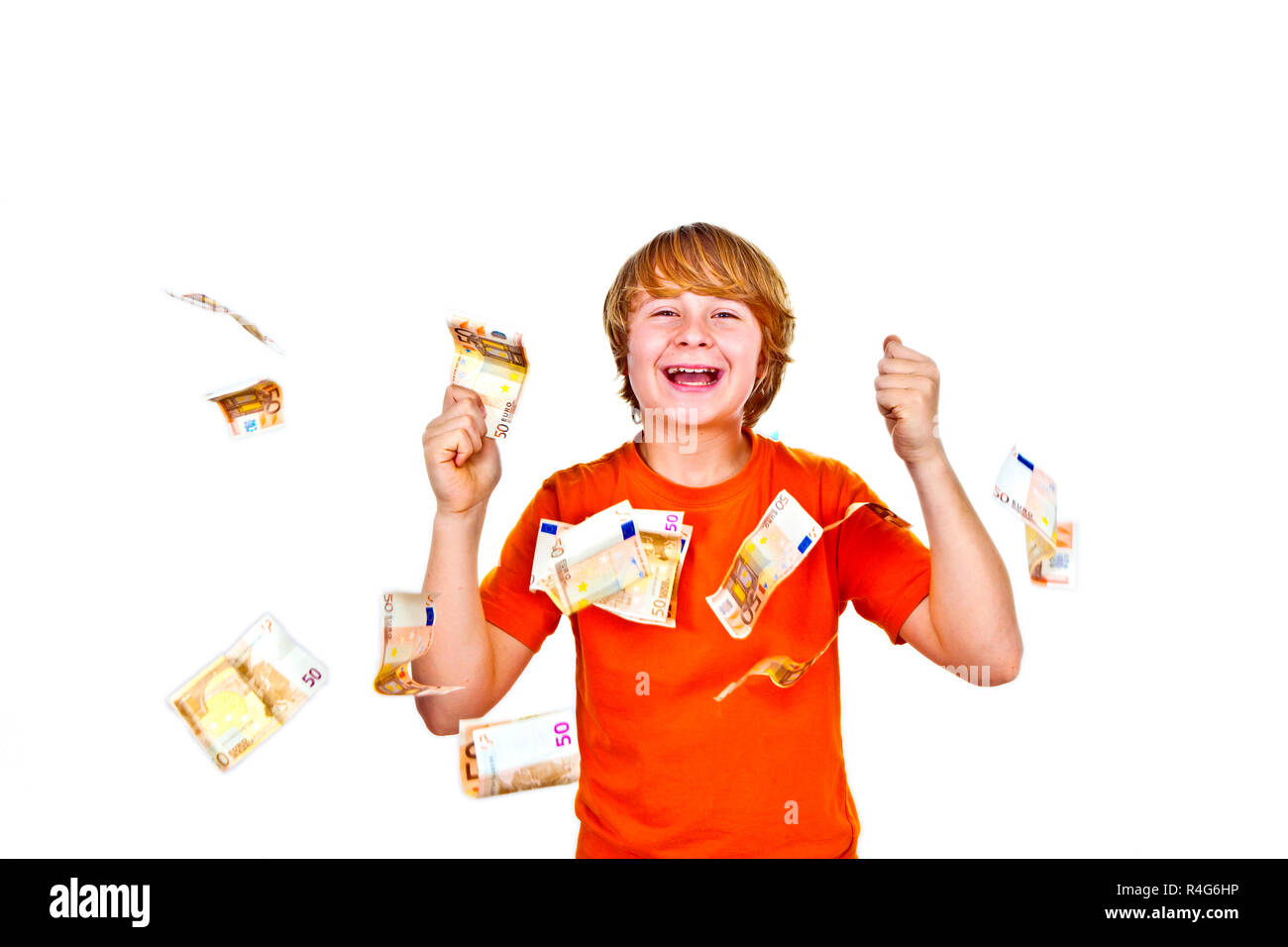 Euros flying around a boys head Stock Photo