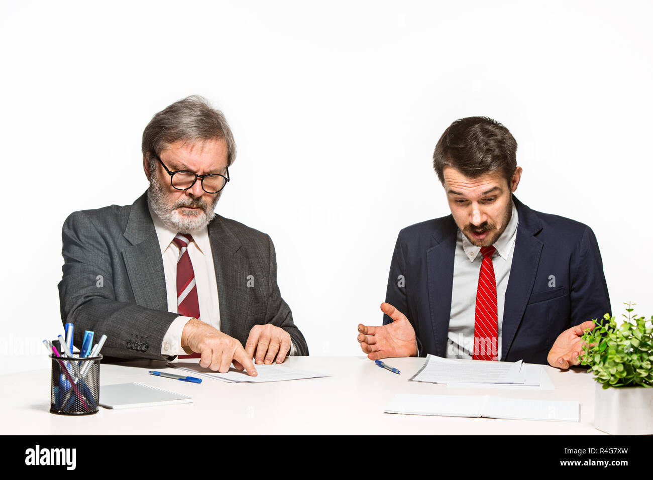 Two Team Members The two colleagues working together at office on white background Stock ...