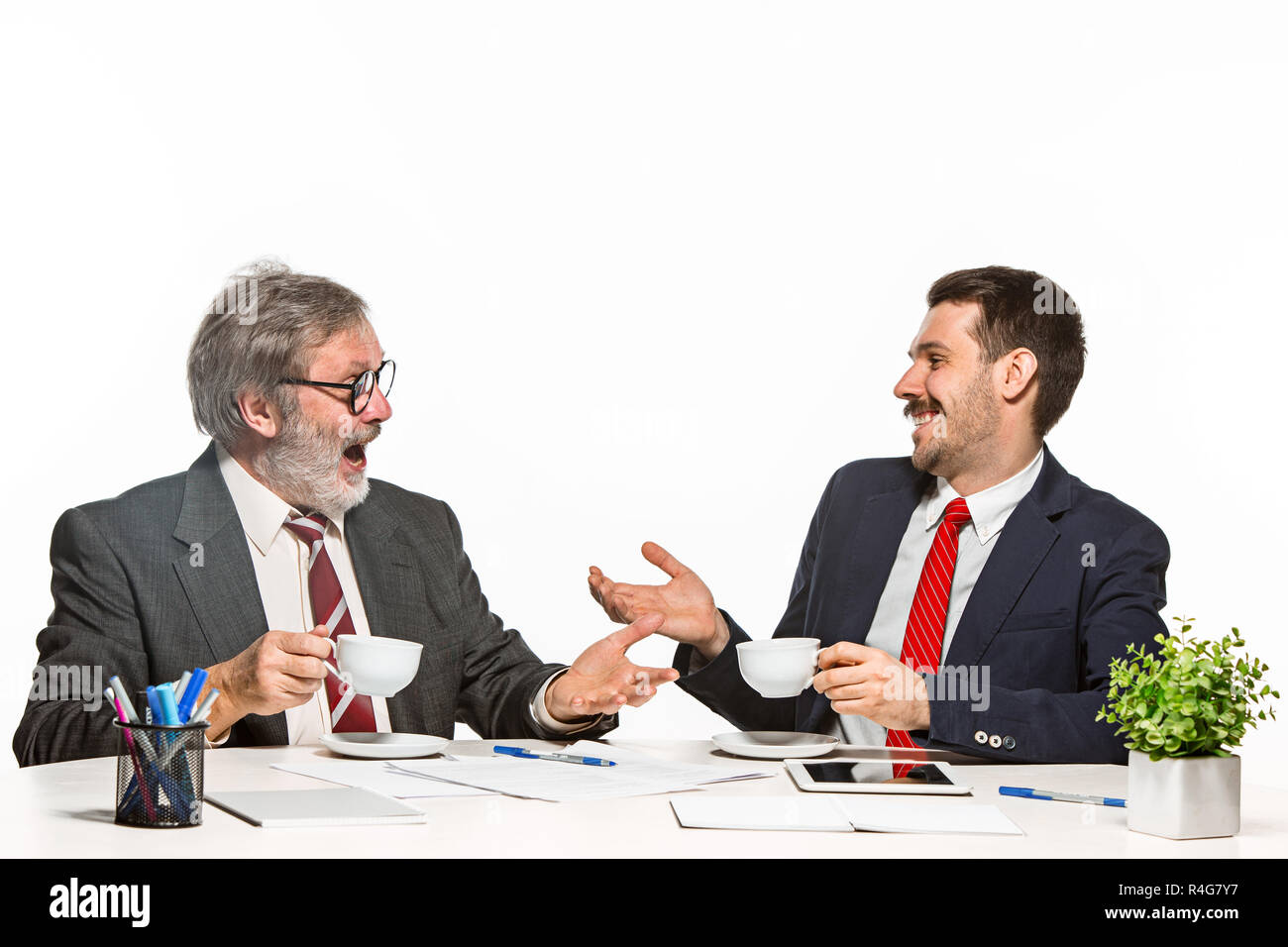 Two Team Members The two colleagues working together at office on white background Stock ...