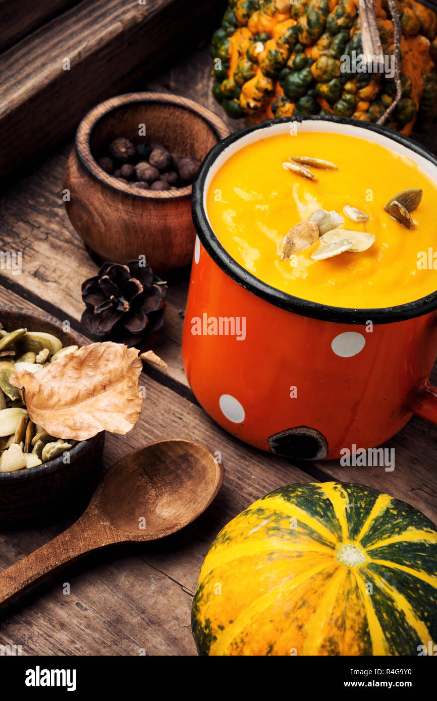 Autumn pumpkin soup in a metal cup. Autumn food Stock Photo - Alamy