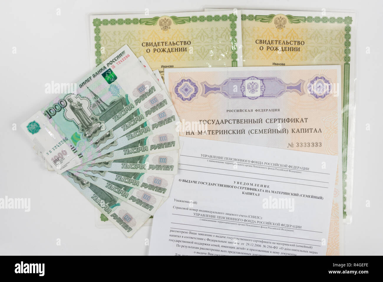 Image showcasing On a white background are two of a birth certificate, a certificate for ...