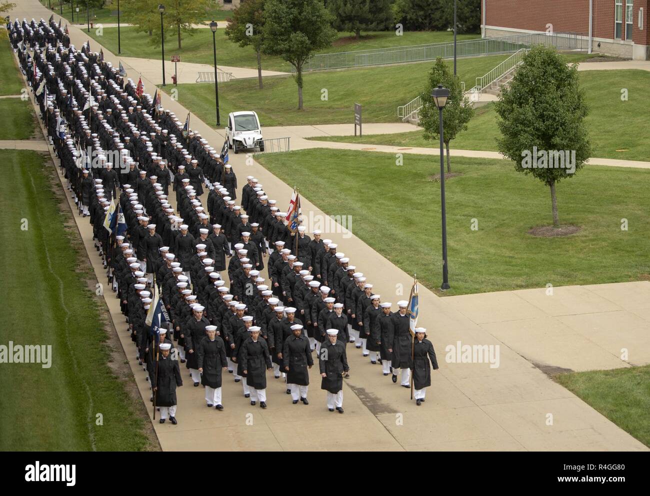 GREAT LAKES, Ill. (Sept. 28, 2018) Eight hundred ninety-three Sailors march toward Midway Ceremonial Drill Hall for their pass-in-review graduation ceremony at Recruit Training Command (RTC). More than 30,000 recruits graduate annually from the Navy's only boot camp. Stock Photo