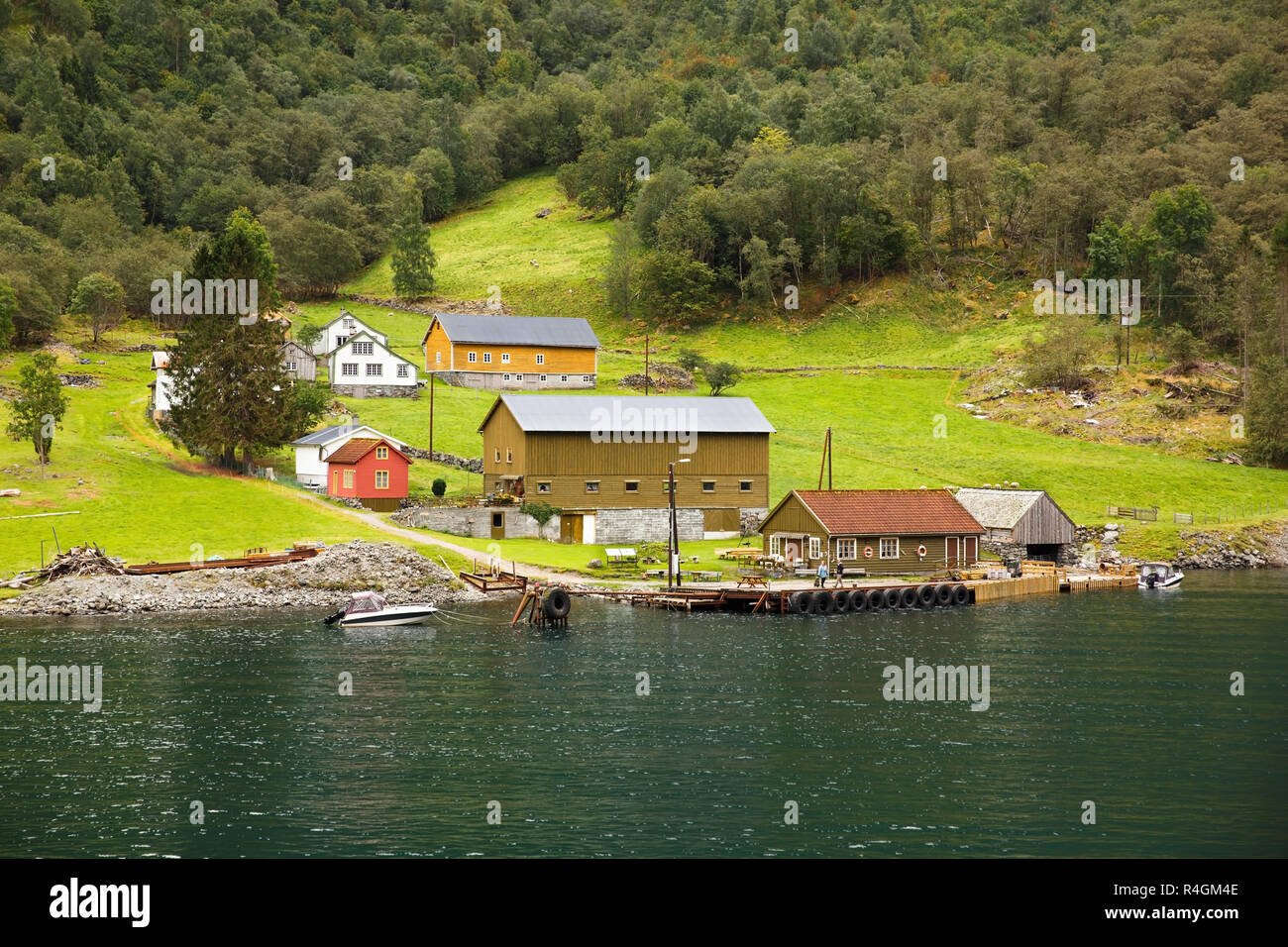 Landscape with Naeroyfjord, mountains and traditional village house in