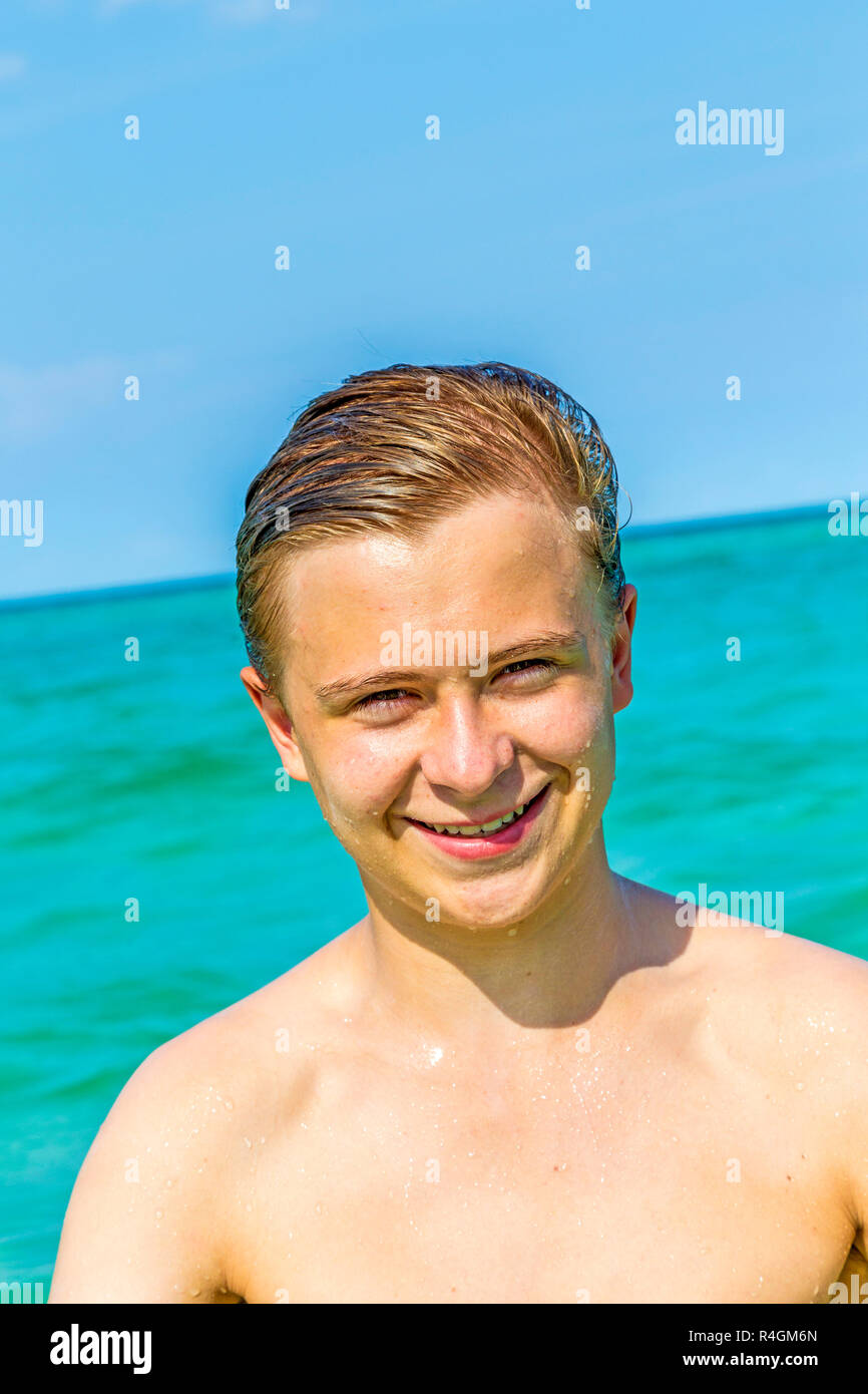 handsome teen has fun at the beach Stock Photo - Alamy