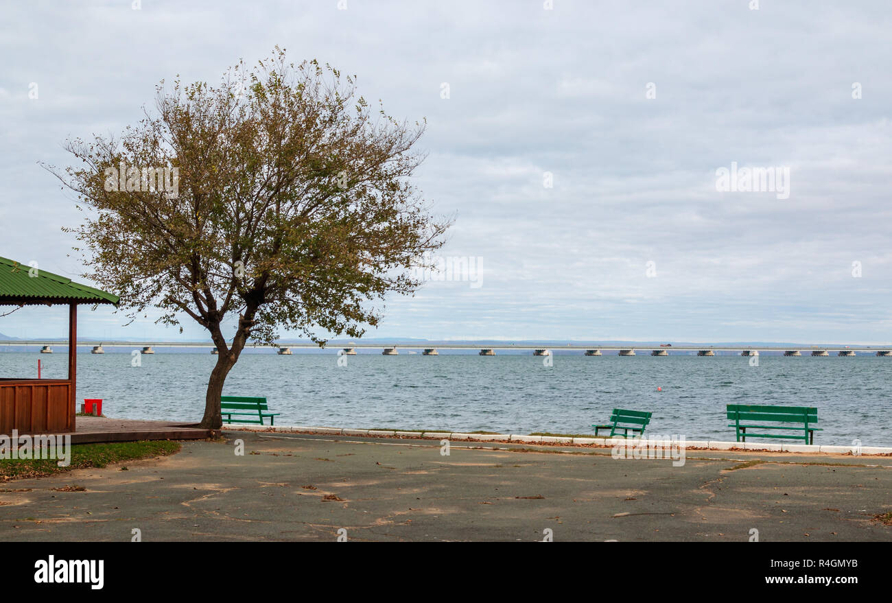 Low water bridge from Sedanka to the De Friz peninsula across the Amur Bay of Primorsky Krai Russia. Far Eastern landscape. Stock Photo