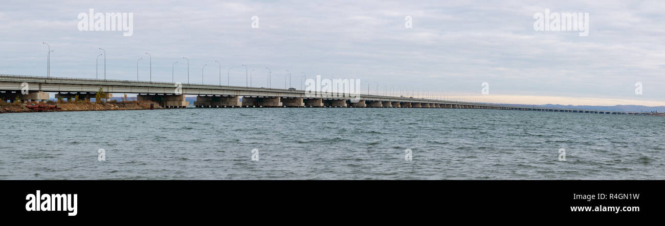 Low water bridge from Sedanka to the De Friz peninsula across the Amur Bay of Primorsky Krai Russia. Far Eastern landscape. Stock Photo