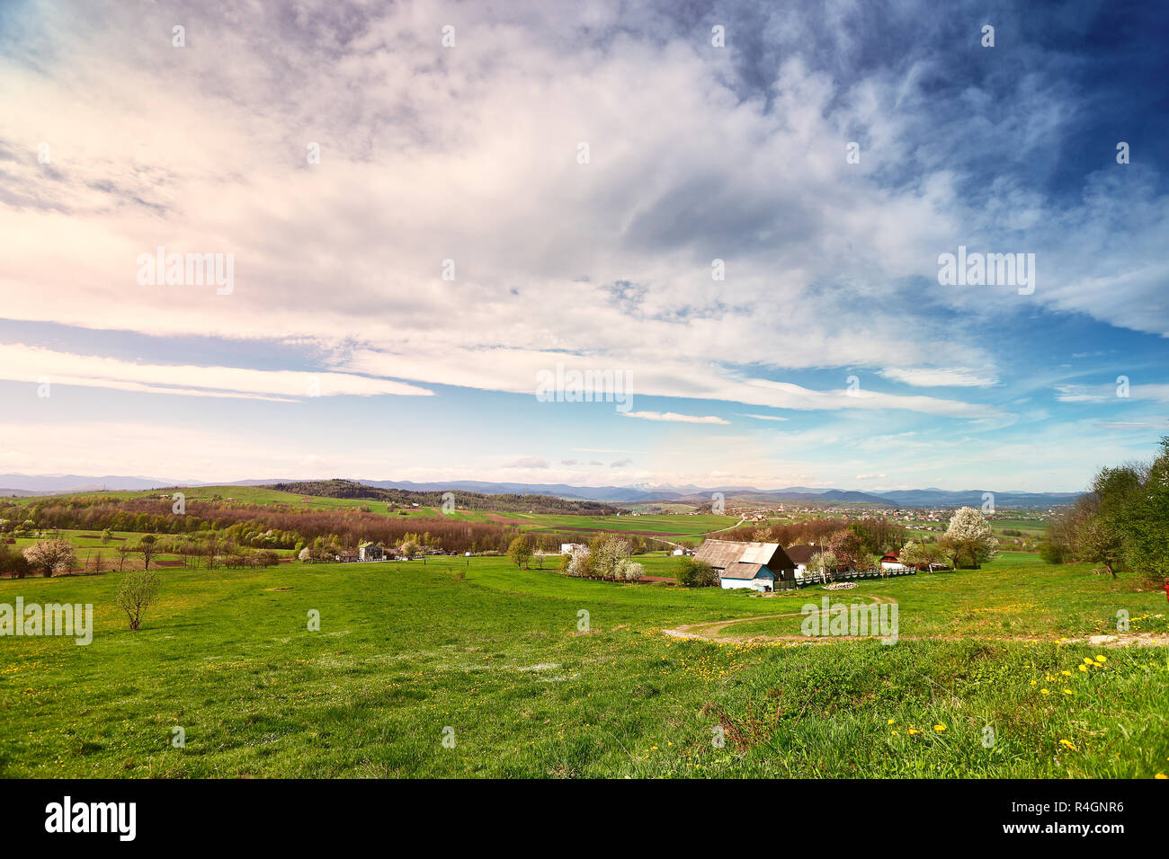 Sunny spring day in village and town on foothills Stock Photo - Alamy