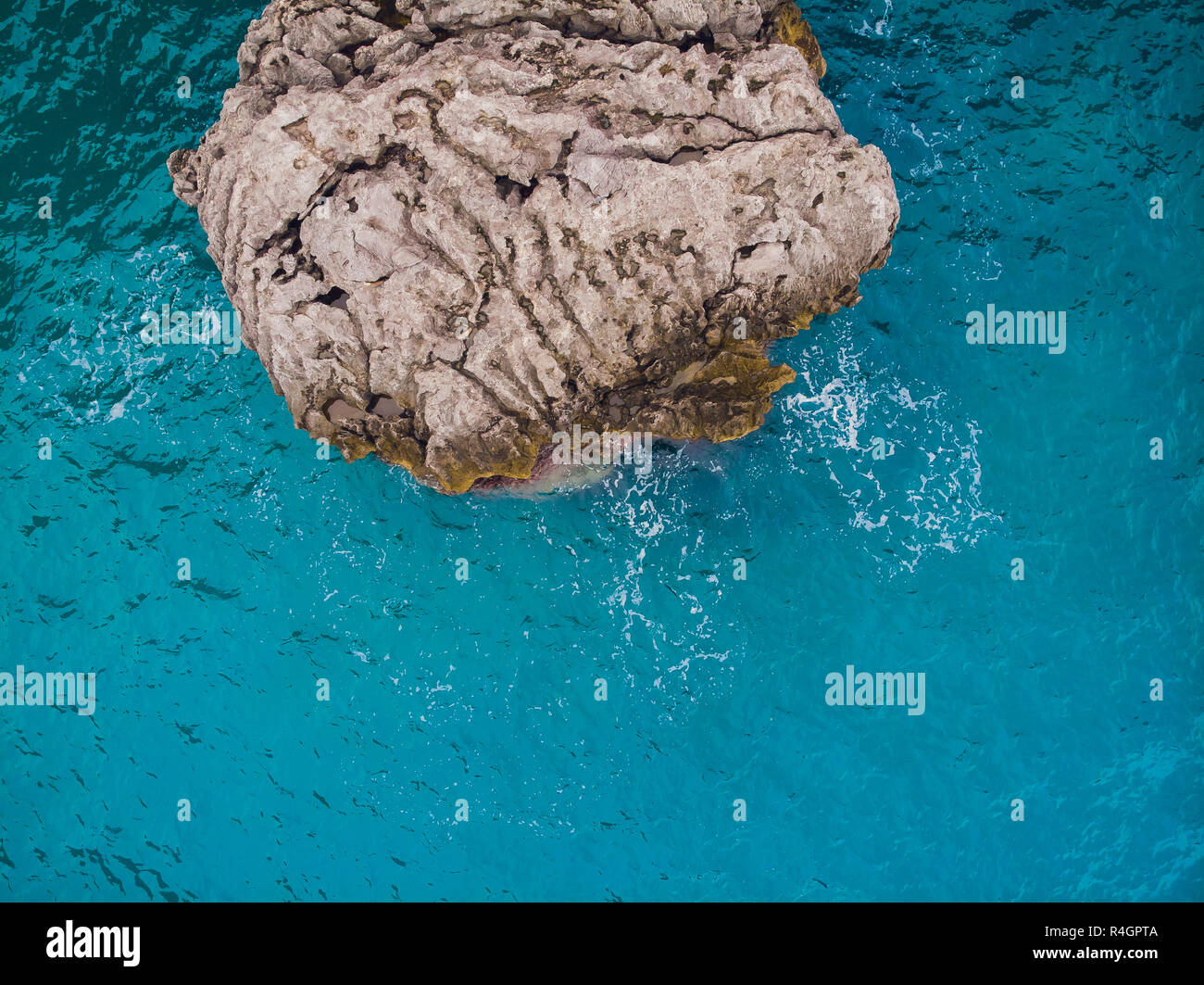 Aerial top view of sea waves hitting rocks Stock Photo - Alamy