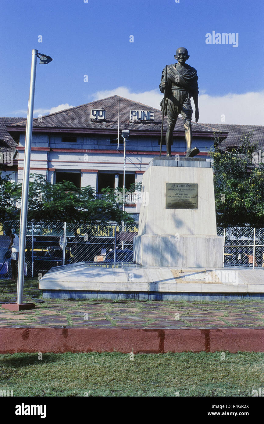 Statue of Mahatma Gandhi and Pune railway station, Maharashtra, India