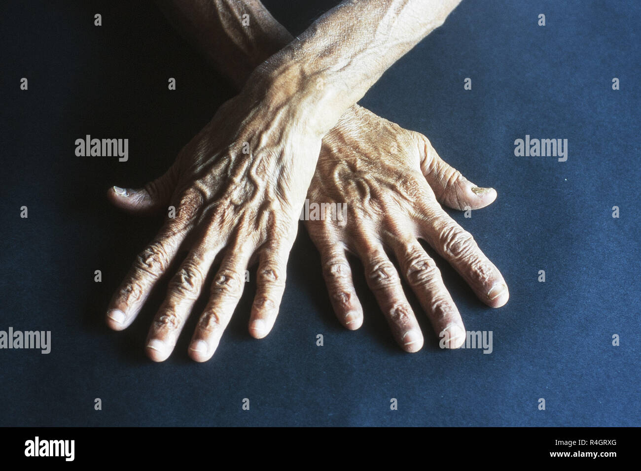 Wrinkled hands of old man Stock Photo