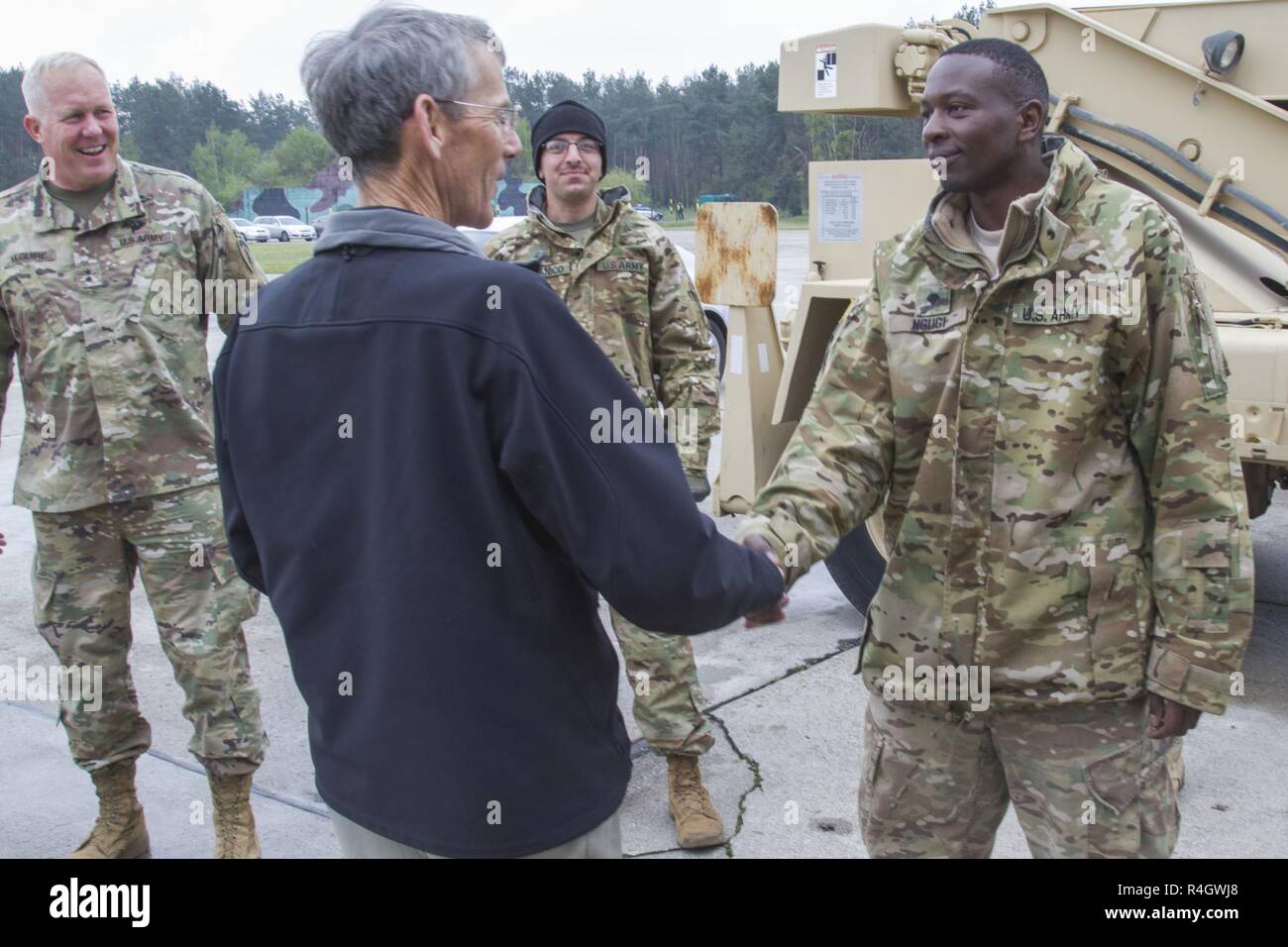 the-honorable-mr-robert-m-speer-acting-secretary-of-the-army-rewards-spc-samson-ngugi-an-aircraft-pneudraulics-repairer-with-1-501st-attack-reconnaissance-battalion-task-force-falcon-10th-combat-aviation-brigade-receives