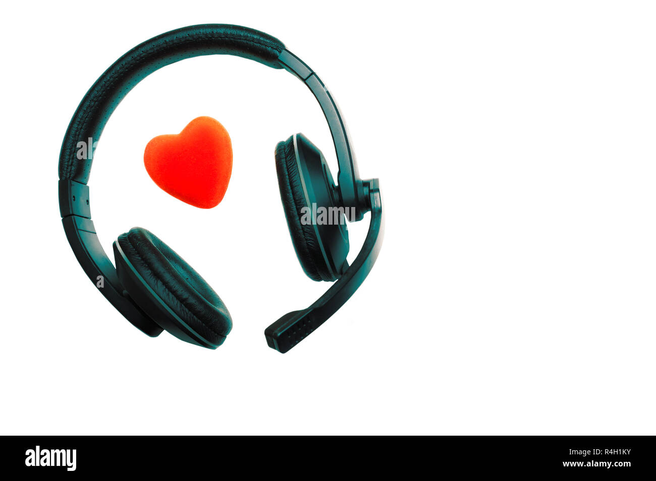 Black and Green Headset, Headphones with Microphone and Red Heart Isolated On White Background.  Call Center, Technical Support, Love, Valentines Day, Stock Photo