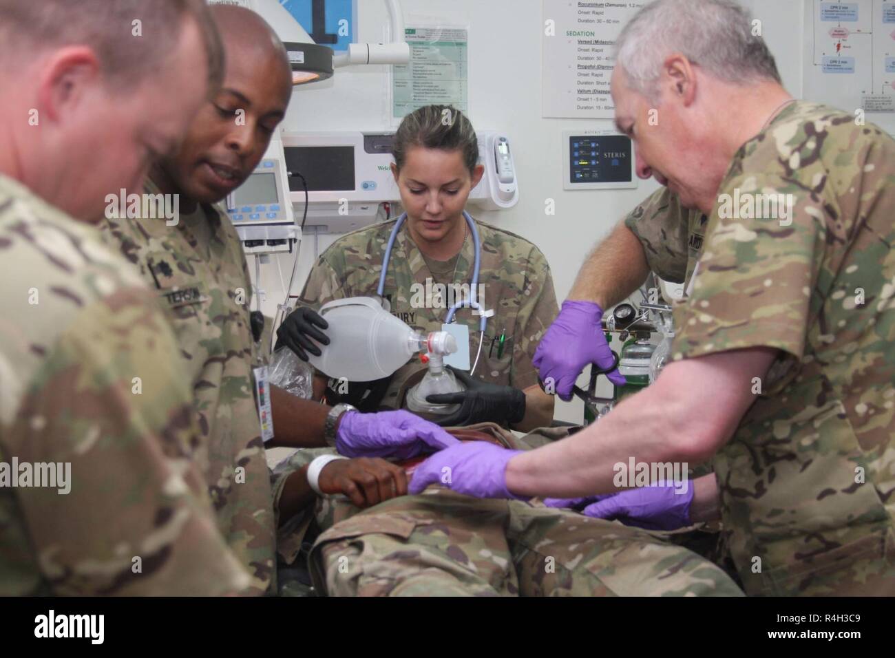 Soldiers attached to the 452nd Combat Support Hospital, treat patients during a multi-camp Mass Casualty Training Exercise at Camp Arifjan, September 26, 2018. Stock Photo
