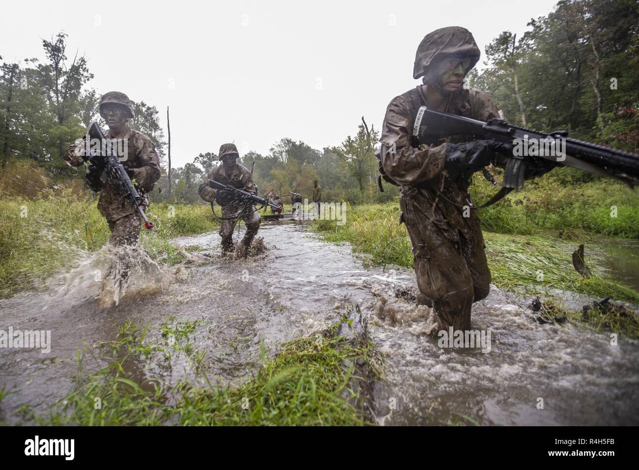 U.S. Marine candidates of the Officer Candidate School, Delta company, participate in the combat course at Quantico, Va., Sep 24, 2018. This training is conducted to prepare candidates for future mental and physical challenges. Stock Photo