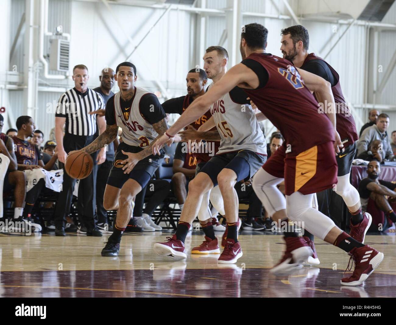 Members of the Cleveland Cavaliers play their Wine & Gold Scrimmage inside a 445th Airlift Wing hangar at Wright-Patterson Air Force Base, Ohio, Sept. 30, 2018. This is the first time the scrimmage, which consisted of two 12-minute periods, was played on a military installation. Stock Photo