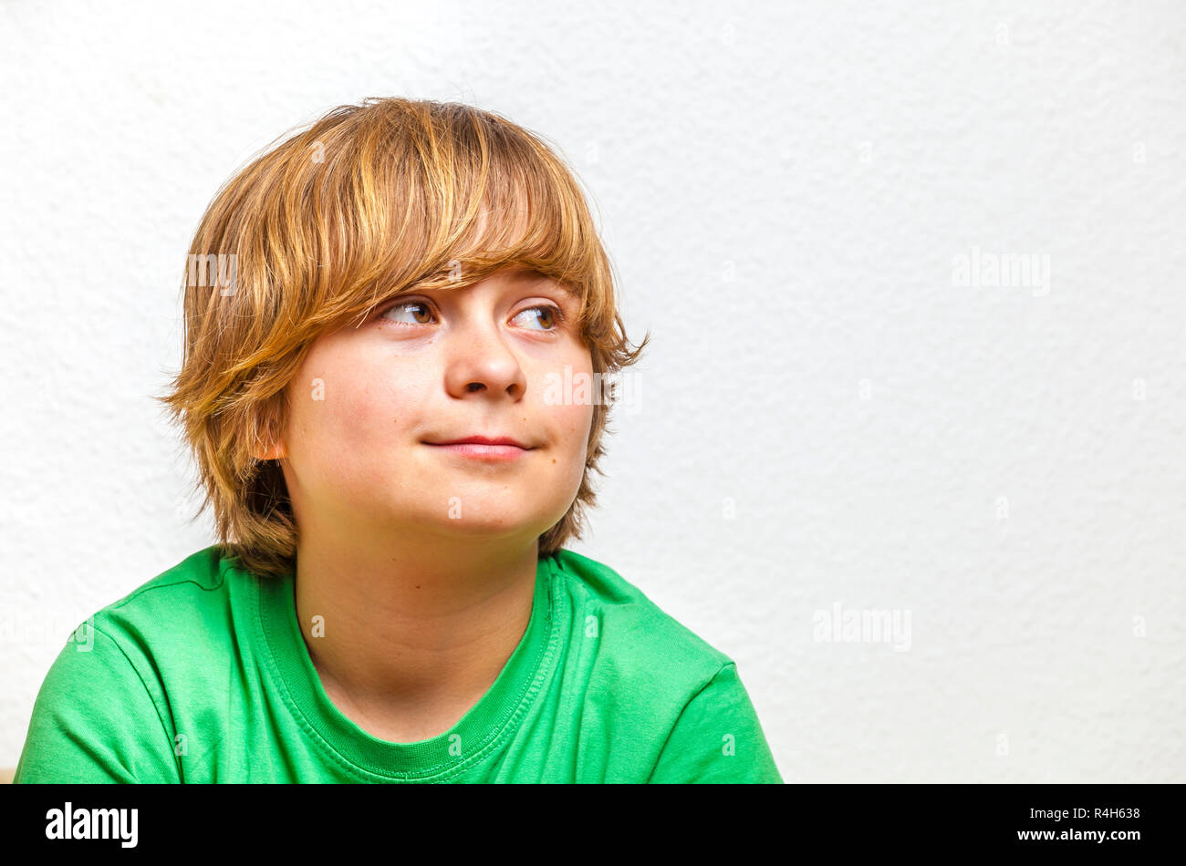 cute boy in green shirt Stock Photo - Alamy