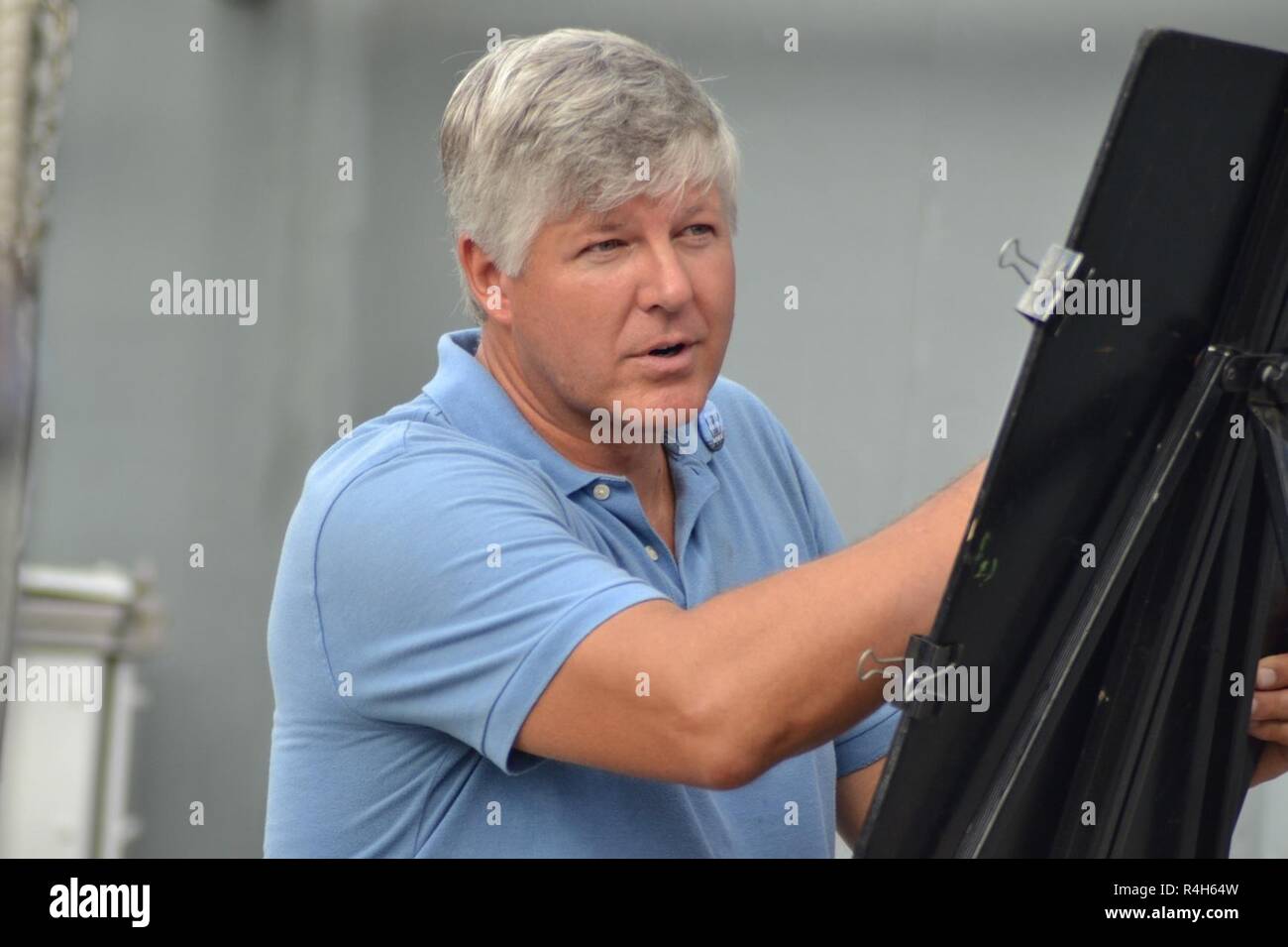 Bob Langston, a local professional artist, draws caricature pictures of