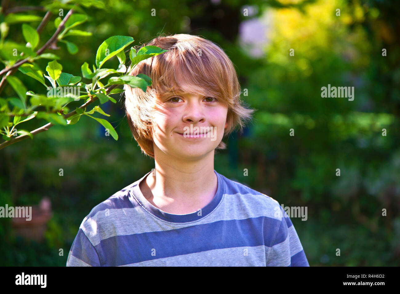 cute smiling boy with cheeky smile Stock Photo - Alamy