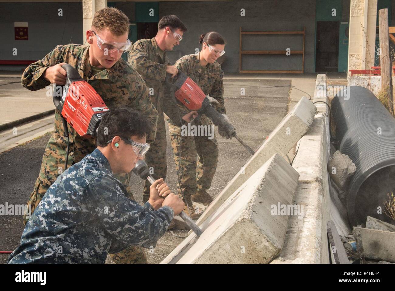SAN FRANCISCO (Oct. 2, 2018) Sailors and Marines practice concrete breaching techniques during the annual Defense Support of Civil Authorities (DSCA) exercise at San Francisco Fleet Week (SFFW) 2018. SFFW is an opportunity for the American public to meet their Navy, Marine Corps and Coast Guard teams and experience America's sea services. During fleet week, service members participate in various community service events, showcase capabilities and equipment to the community, and enjoy the hospitality of San Francisco and its surrounding areas. Stock Photo