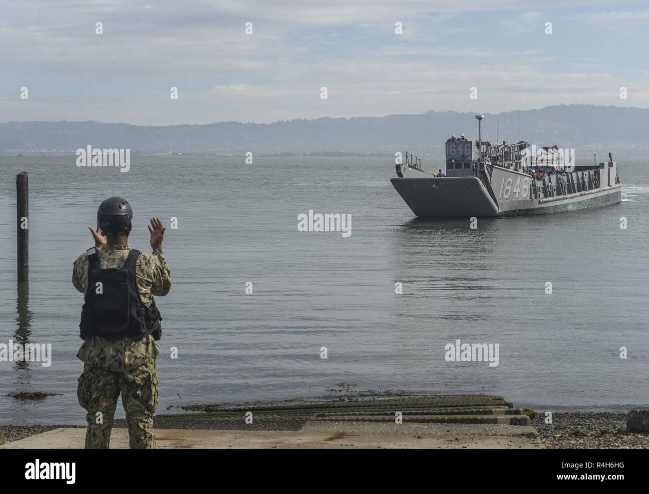 SAN FRANCISCO (Oct. 2, 2018) Boatswain’s Mate Seaman Mark Durand, a native of St. John, U.S. Virgin Islands, guides a landing craft unit to the beach during the annual Defense Support of Civil Authorities (DSCA) exercise at San Francisco Fleet Week (SFFW) 2018. SFFW is an opportunity for the American public to meet their Navy, Marine Corps and Coast Guard teams and experience America's sea services. During fleet week, service members participate in various community service events, showcase capabilities and equipment to the community, and enjoy the hospitality of San Francisco and its surround Stock Photo
