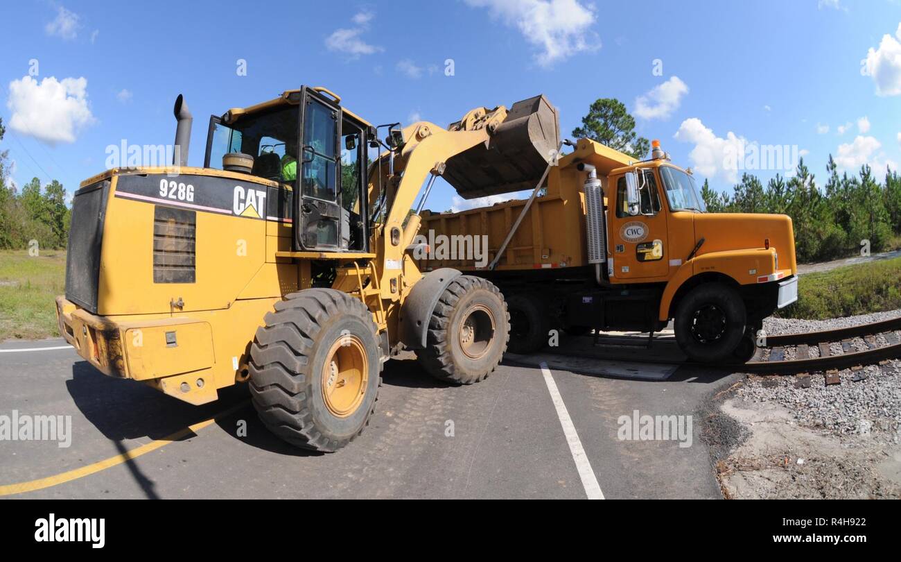 a-civil-works-contracting-cwc-bulldozer-loads-dirt-into-a-high-rail