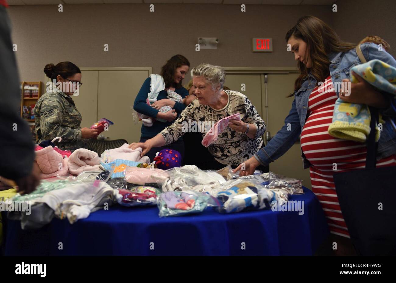 Michelle Davis, an expectant mother, looks at information pamphlets during Bundles for Babies at Beale Air Force Base, California, Sept. 20, 2018. Attendees received financial and budgeting advice for their new baby, as well as a $50 Army Air Force Exchange Service Gift Card provided by the Air Force Aid Society. Stock Photo