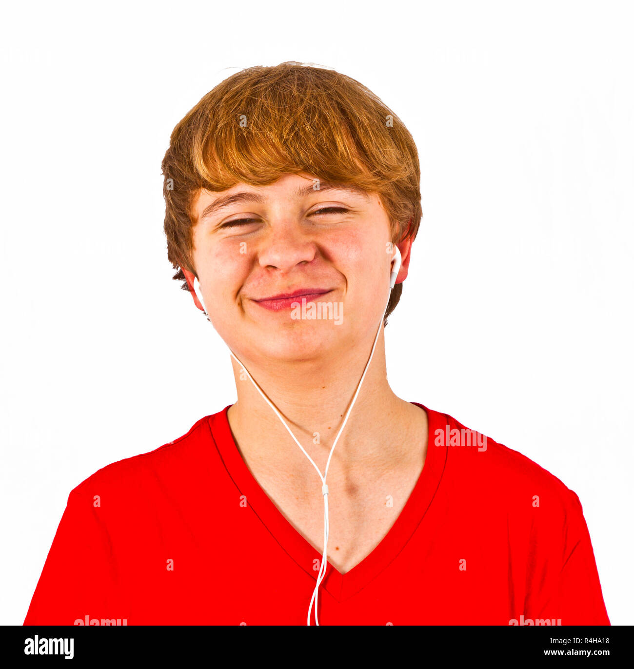 happy boy listening to music via earphone Stock Photo - Alamy