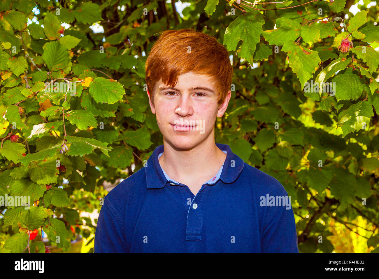 portrait of attractive happy smiling boy in the garden Stock Photo - Alamy