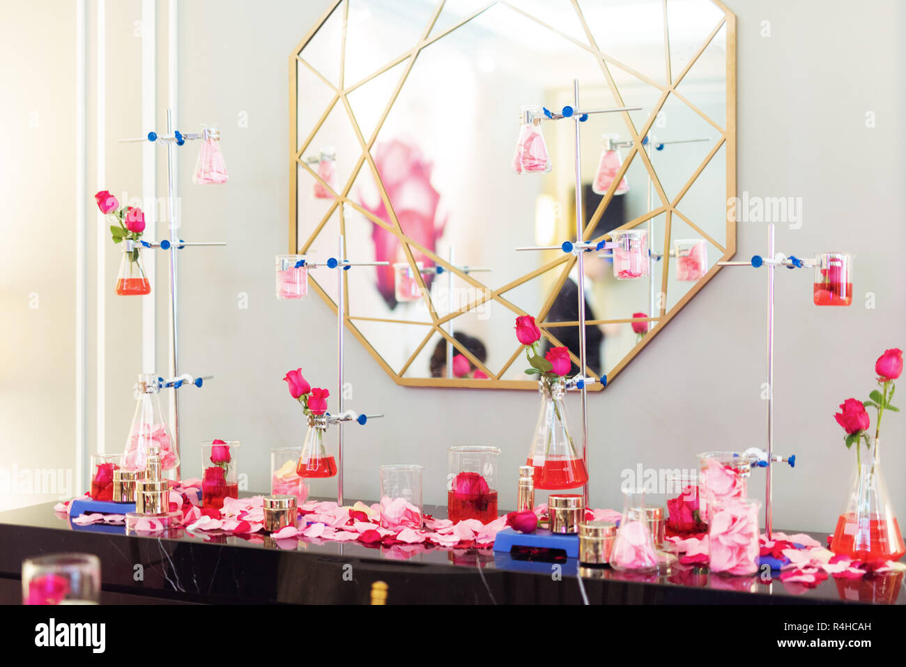 Creative interior design with roses and glass beakers Stock Photo - Alamy