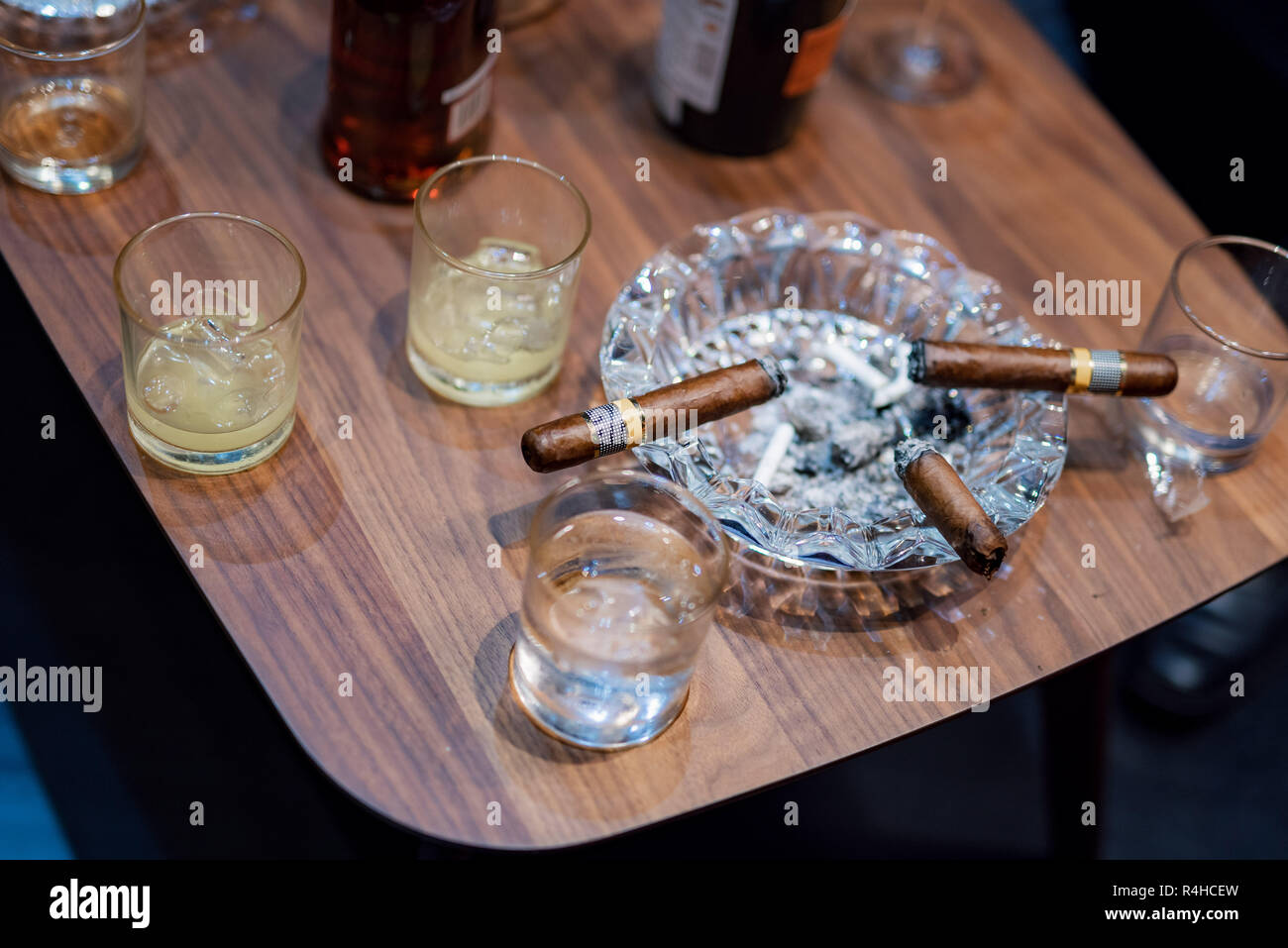 alcohol beverage and tobacco Cigars and alcohol beverage on wooden table Stock Photo