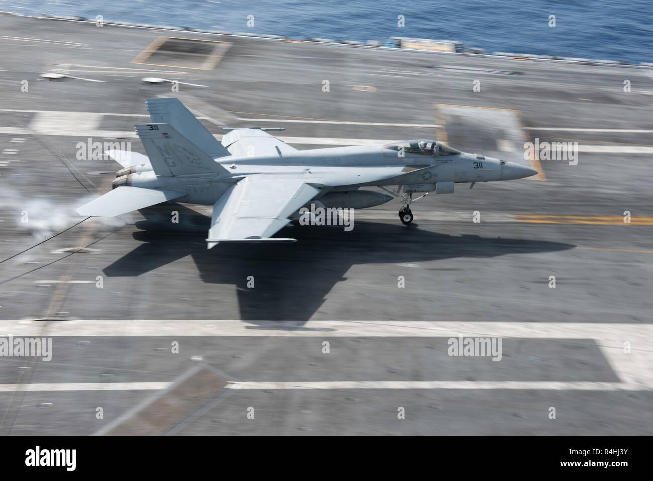 181122-N-PI076-0170    SOUTH CHINA SEA (Nov. 22, 2018) An F/A-18E Super Hornet, with Strike Fighter Squadron (VFA) 97, lands on the flight deck aboard the Nimitz-class aircraft carrier USS John C. Stennis (CVN 74). John C. Stennis is underway conducting routine operations in the U.S. Pacific Fleet area of operations. (U.S. Navy photo by Mass Communication Specialist Seaman Mitchell Banks) Stock Photo