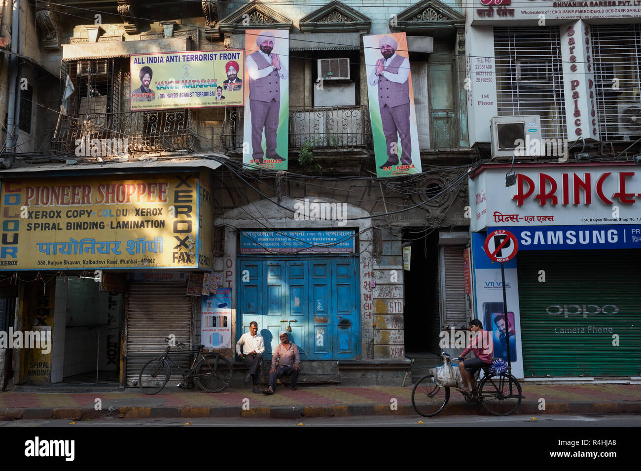 An early morning pre-business hours street scene in Kalbadevi Road, Mumbai, India, one of the city's biggest centres for textile trading Stock Photo
