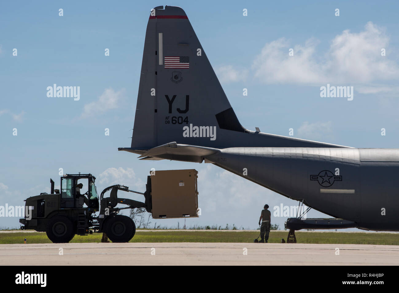 Cargo is loaded onto a C-130J Super Hercules, Nov. 27, 2018, at the Saipan International Airport, Saipan, Commonwealth of the Northern Mariana Islands. Service members from Joint Region Marianas and U.S. Indo-Pacific Command are providing Department of Defense support to the CNMI's civil and local officials as part of the Federal Emergency Management Agency-supported Super Typhoon Yutu recovery efforts. (U.S. Air Force Photo by Tech. Sgt. Joshua J. Garcia) Stock Photo