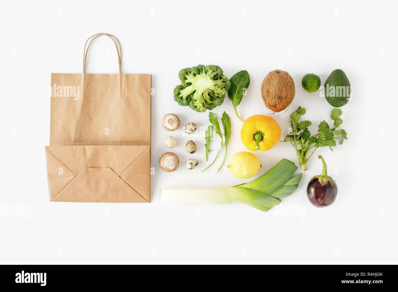 Full paper bag of different health food on white background. Top view. Flat lay. Healthy eating background, top view Stock Photo