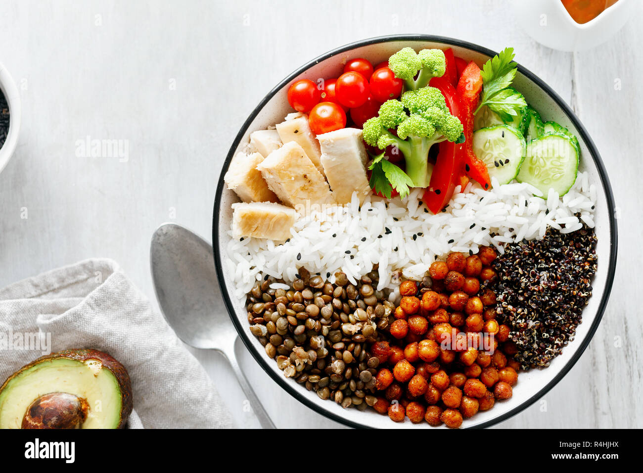 Quinoa, lentil and chickpeas vegetable vegetarian buddha bowl on white wooden table top view. Healthy food Stock Photo