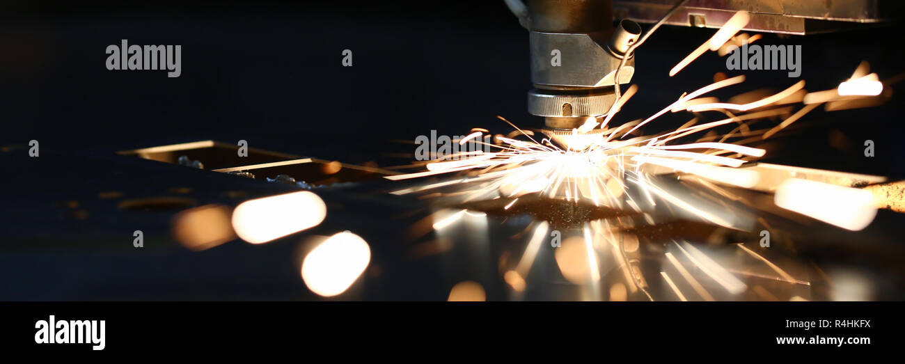 Sparks fly out machine head for metal processing Stock Photo