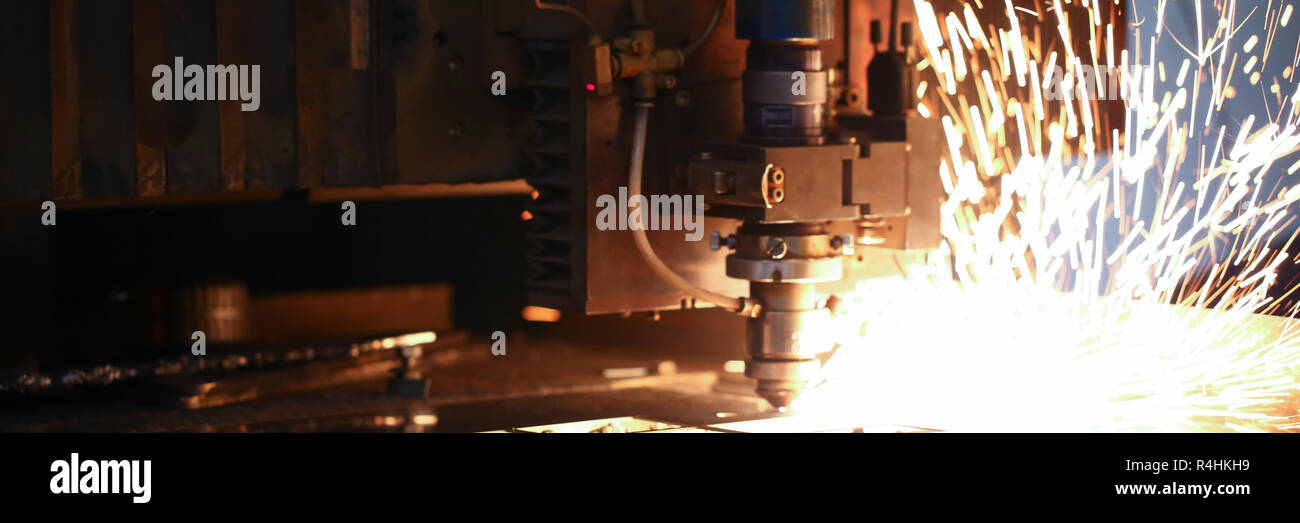 Sparks fly out machine head for metal processing Stock Photo